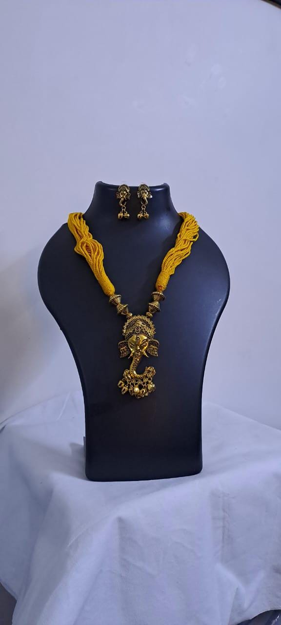 Yellow thread necklace with Golden oxidised traditional pendant