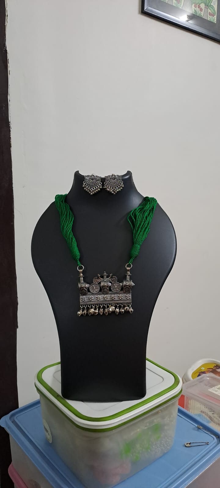 Green thread necklace with silver oxidised traditional pendant