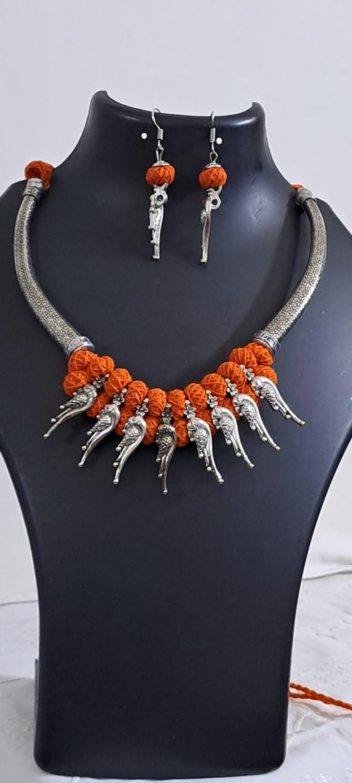 Orange thread necklace with kolhapuri silver oxidised traditional beads and matching earrings