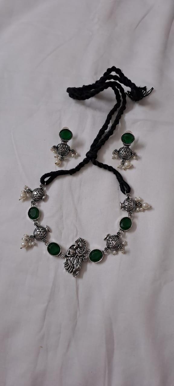Exclusive silver oxidised lstone necklace with radha krishna pendant with matching earrings