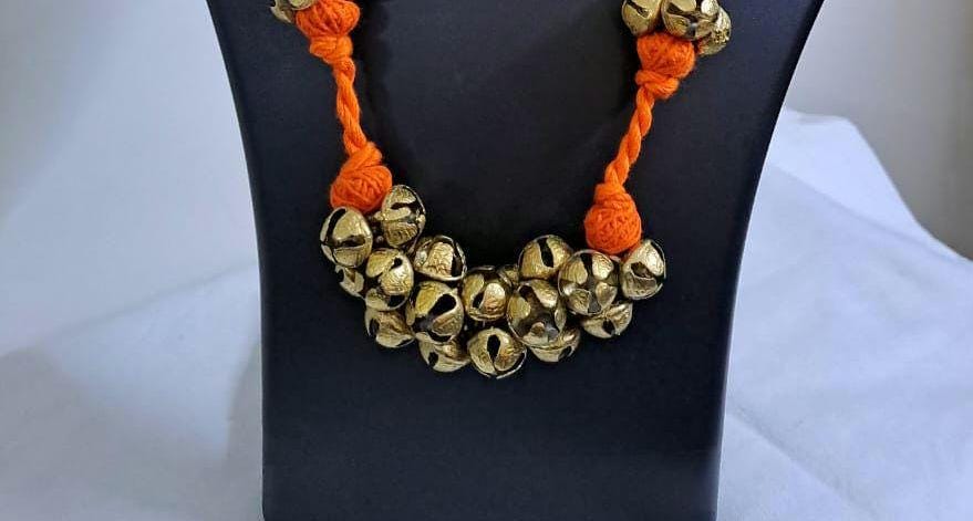Orang thread necklace set with trinkets n matching earrings