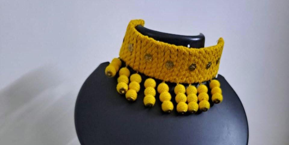 Yellow braided choker necklace set with fringes and matching earrings