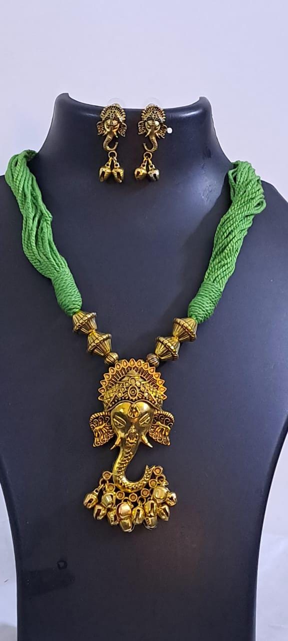 Green thread necklace with Golden oxidised traditional pendant