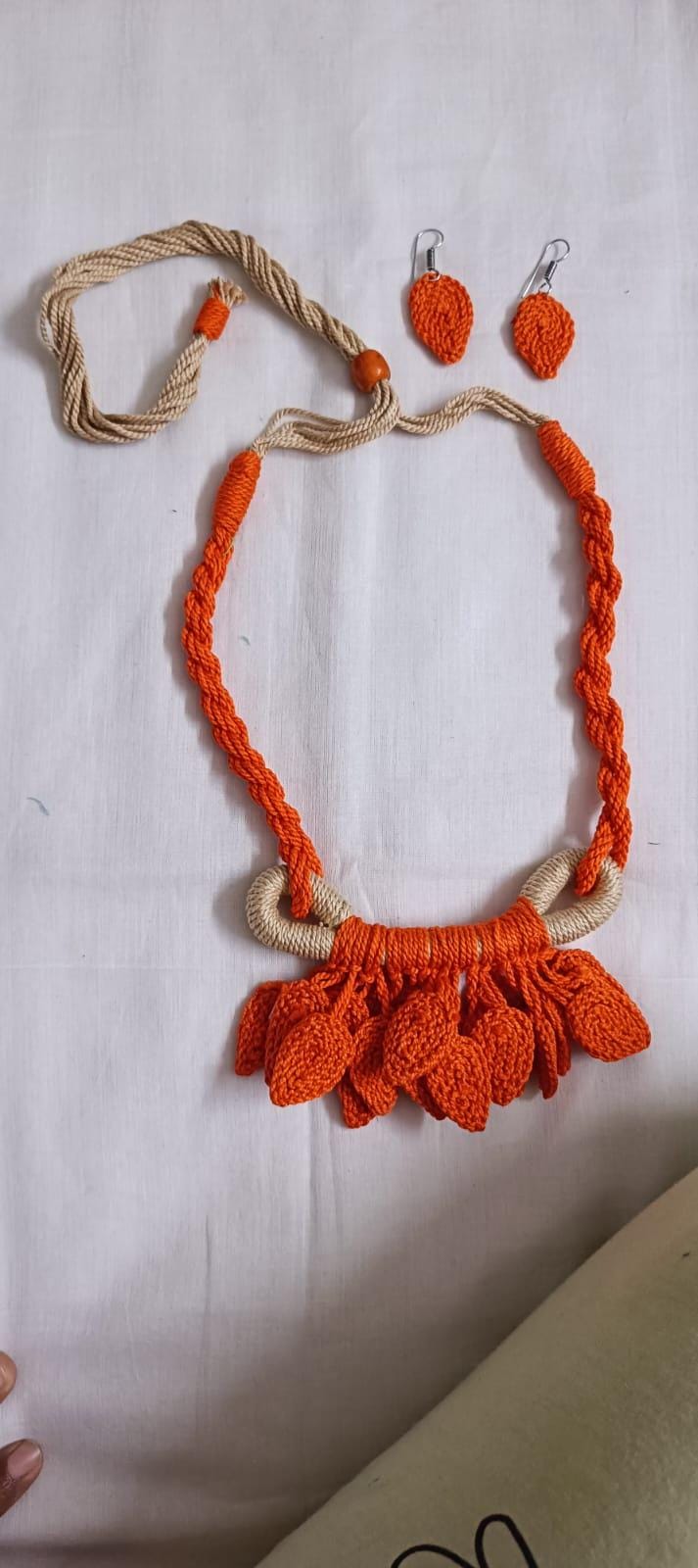 Orange Crochet thread necklace set with leaf fringes and matching earrings