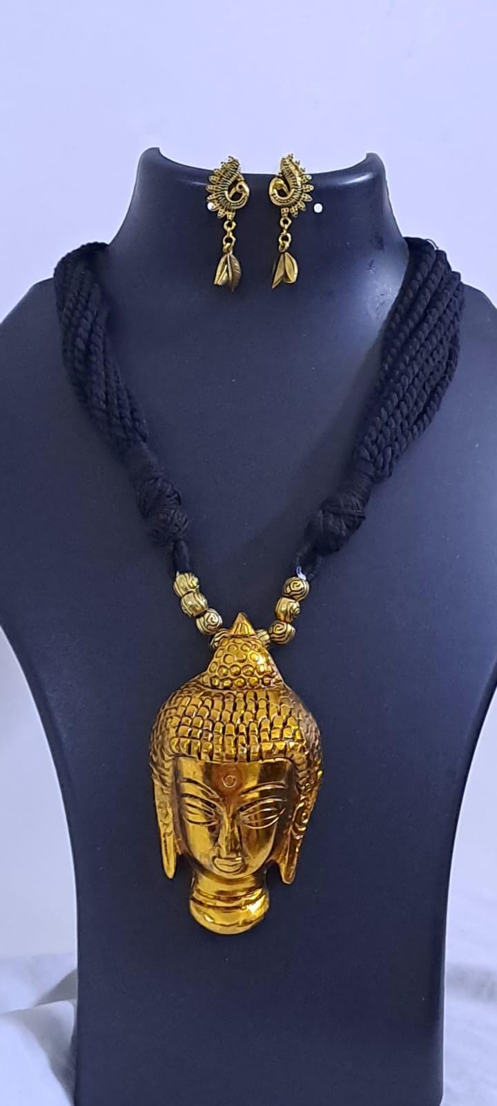 Black thread necklace with oxidised golden buddha pendant
