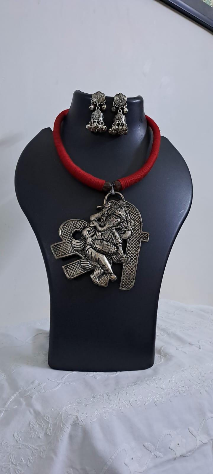 Red thread necklace with silver oxidised ganesha pendant