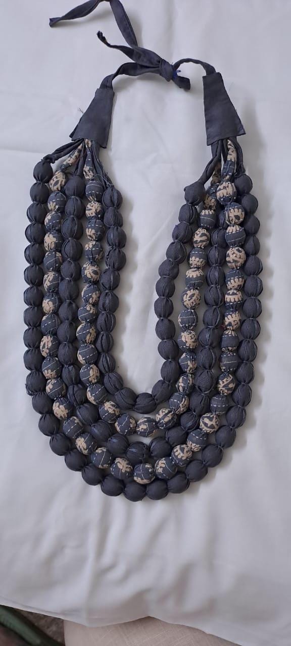 Exclusive multi-layered light grey fabric necklace