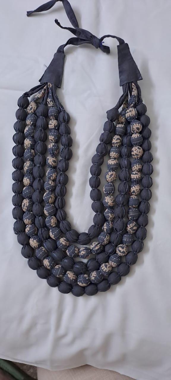 Exclusive multi-layered light grey fabric necklace
