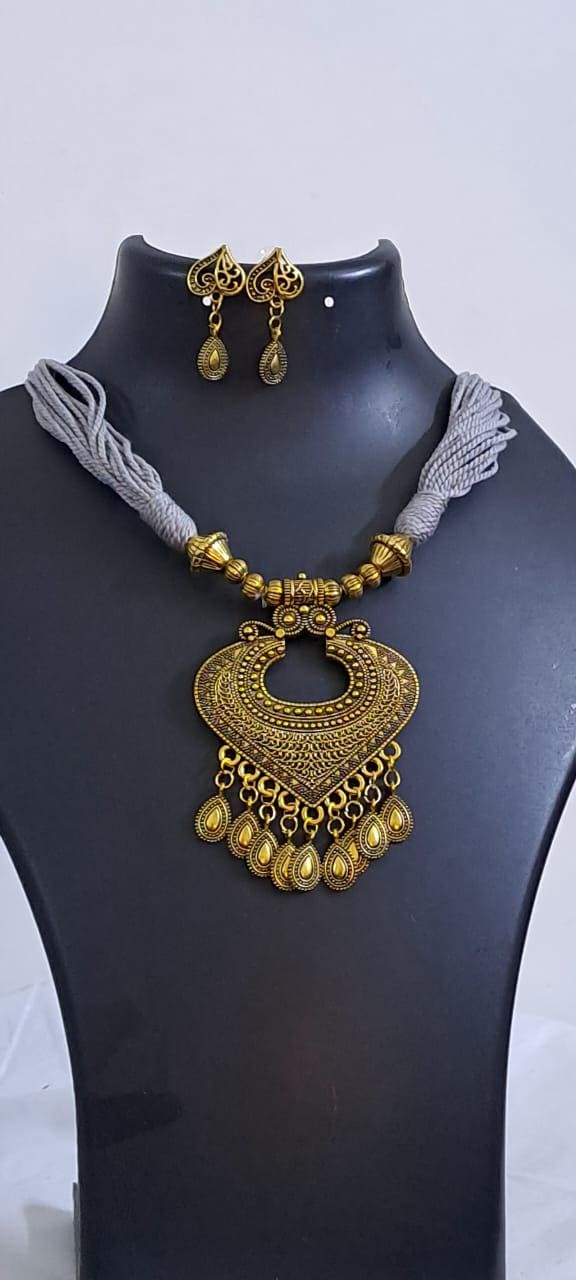 Grey thread necklace with Golden oxidised traditional pendant