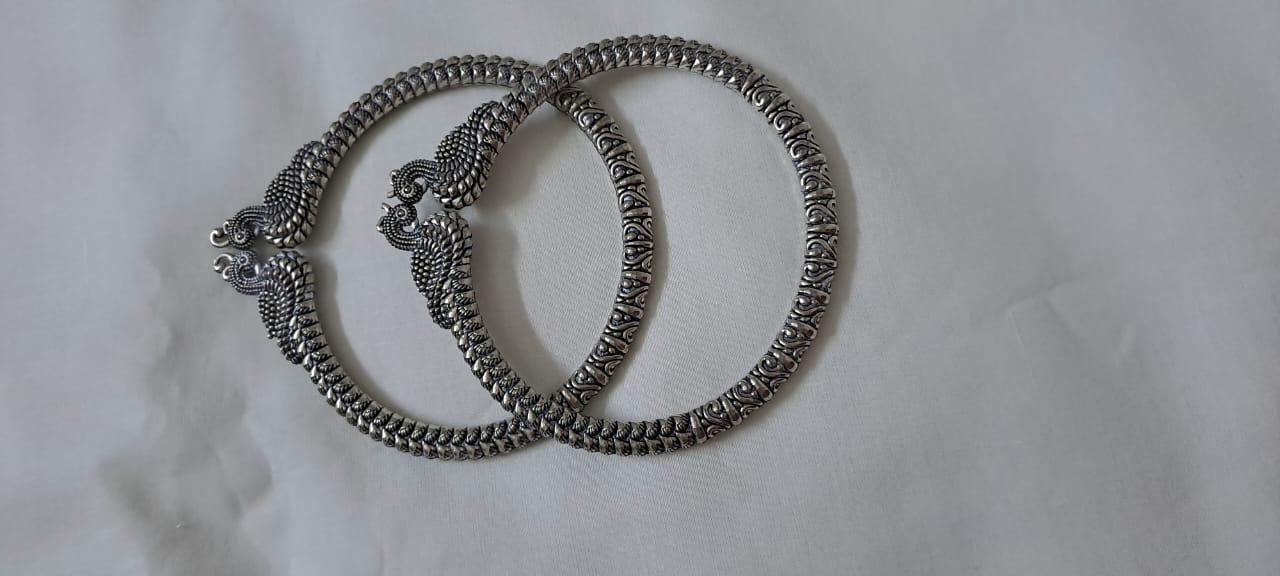 Traditional silver oxidised bangles with peacock
