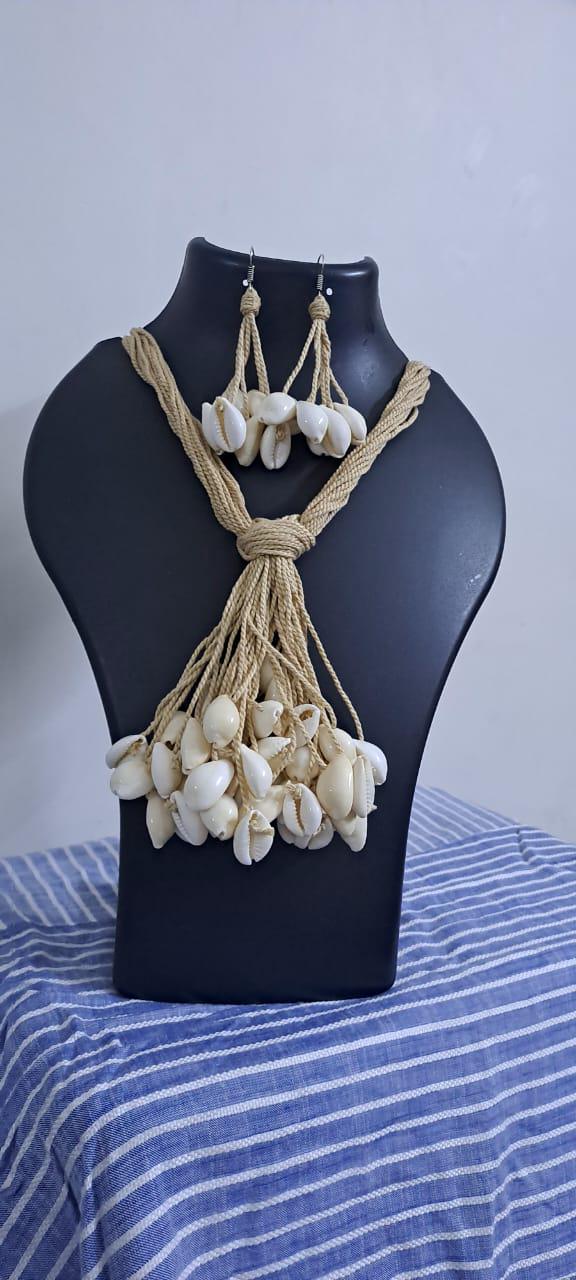 Multi layered jute necklace with shell fringes and with matching earrings.