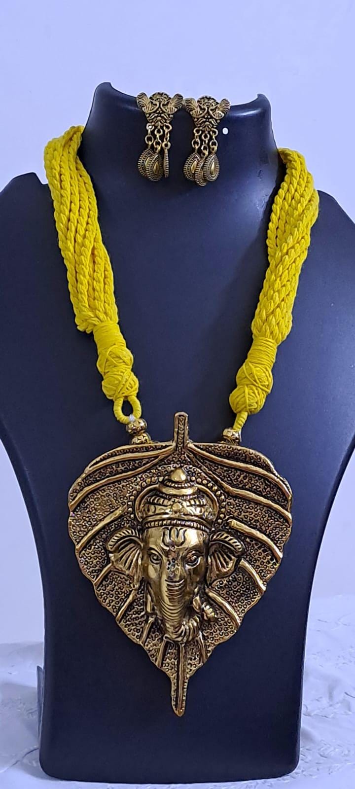 Yellow thread necklace with golden oxidised ganesha pendant