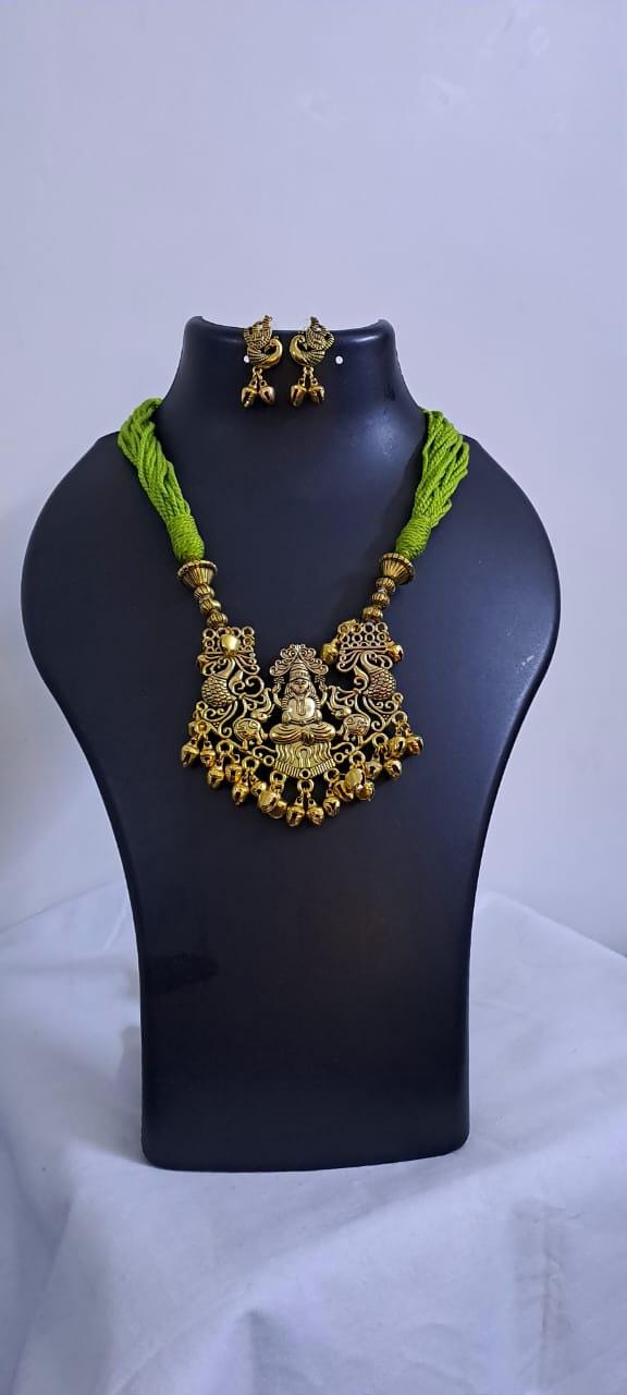 Light green thread necklace with Golden oxidised traditional pendant