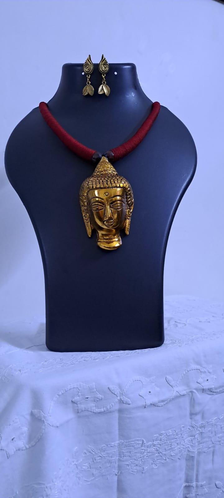 Maroon thread necklace with oxidised golden buddha pendant