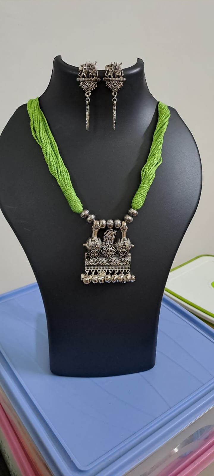 Light green thread necklace with silver oxidised traditional pendant