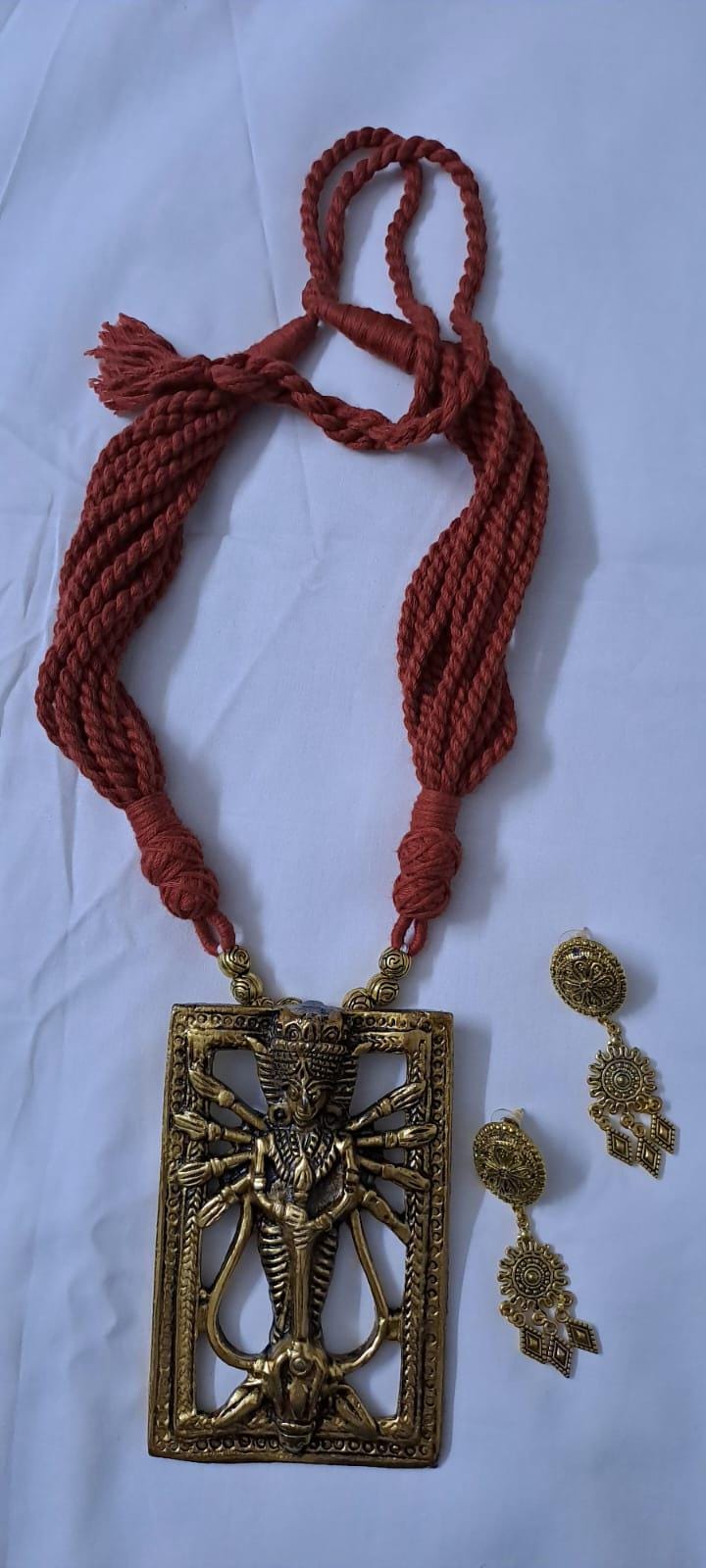 Brown  thread necklace with oxidised golden durga pendant