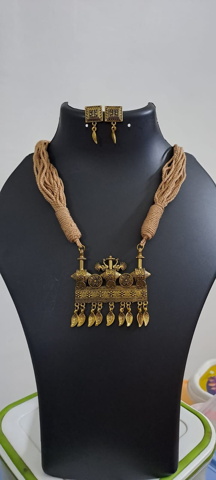 Peach thread necklace with Golden oxidised traditional pendant