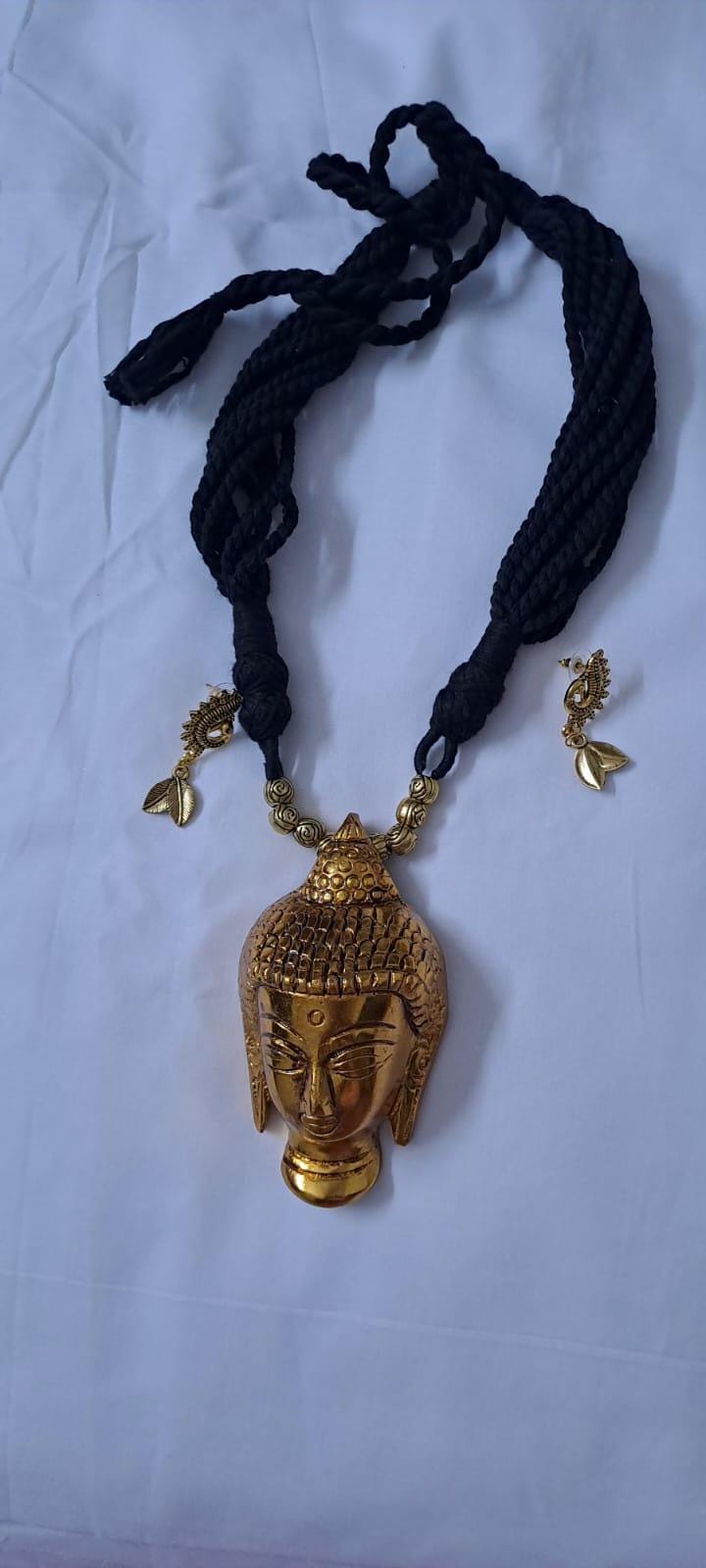 Black thread necklace with oxidised golden buddha pendant