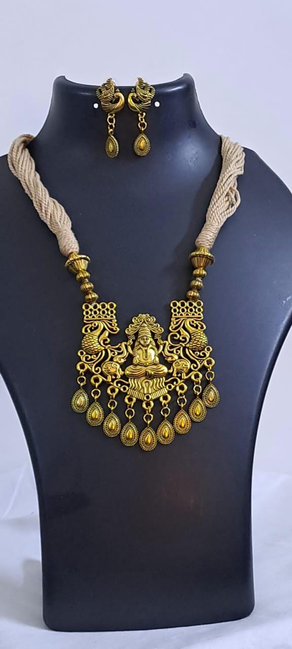 Off white thread necklace with Golden oxidised traditional pendant