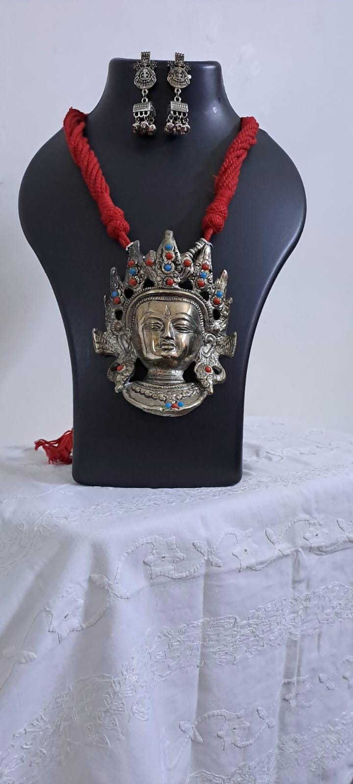 Maroon thread necklace with oxidised silver durga pendant