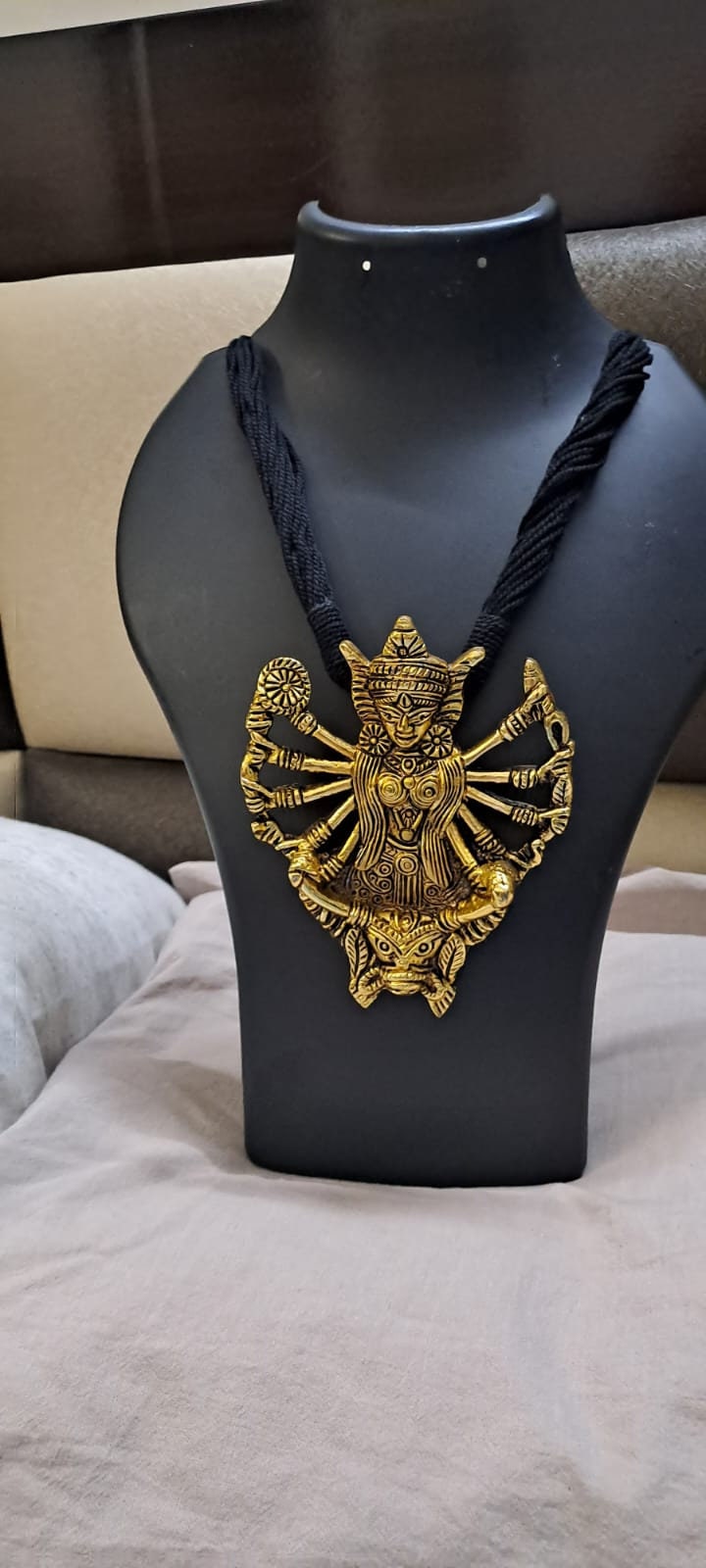 Black thread necklace with oxidised golden durga pendant