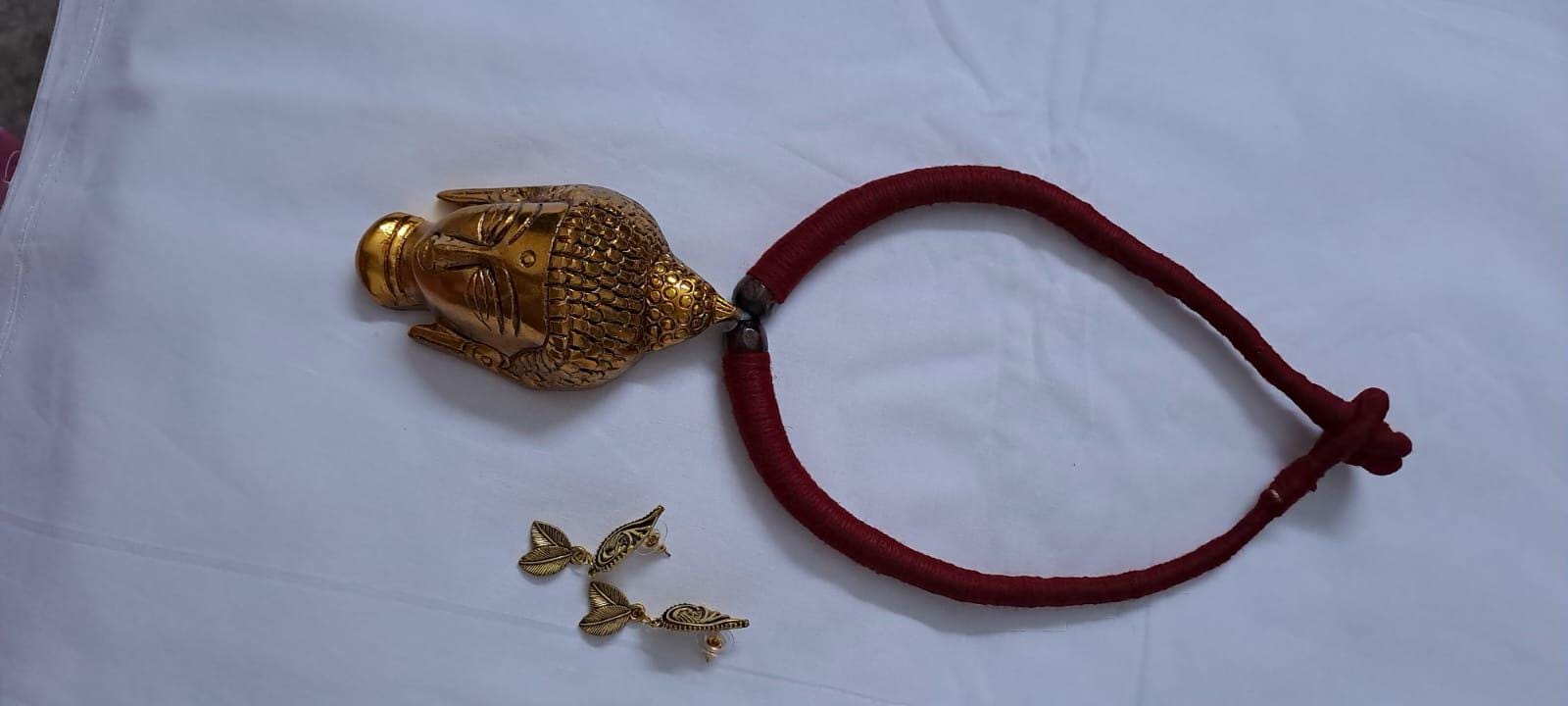 Maroon thread necklace with oxidised golden buddha pendant
