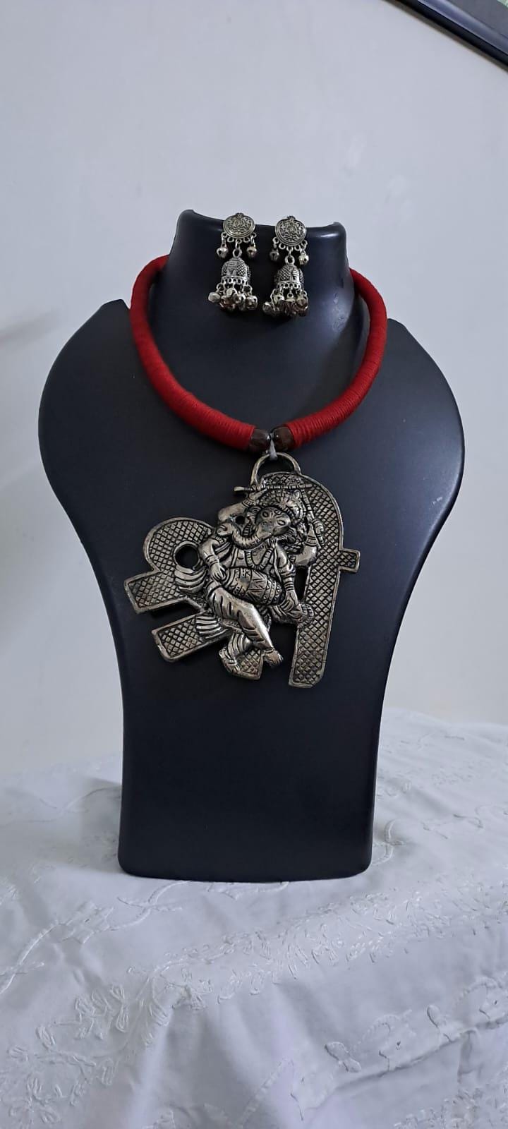 Red thread necklace with silver oxidised ganesha pendant