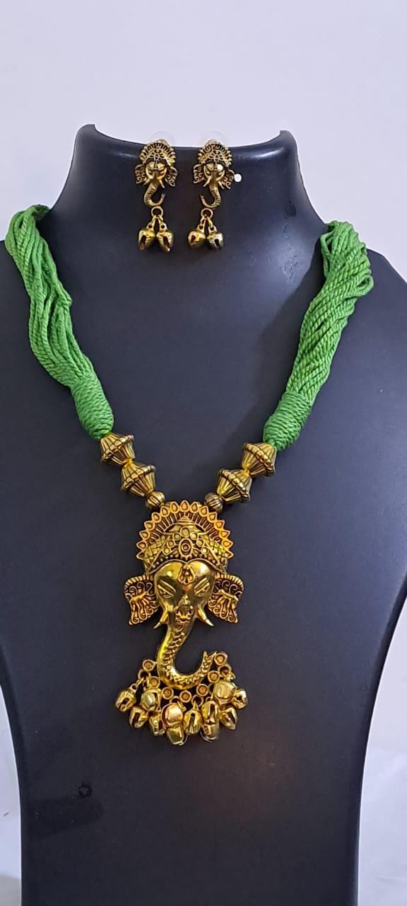 Green thread necklace with Golden oxidised traditional pendant