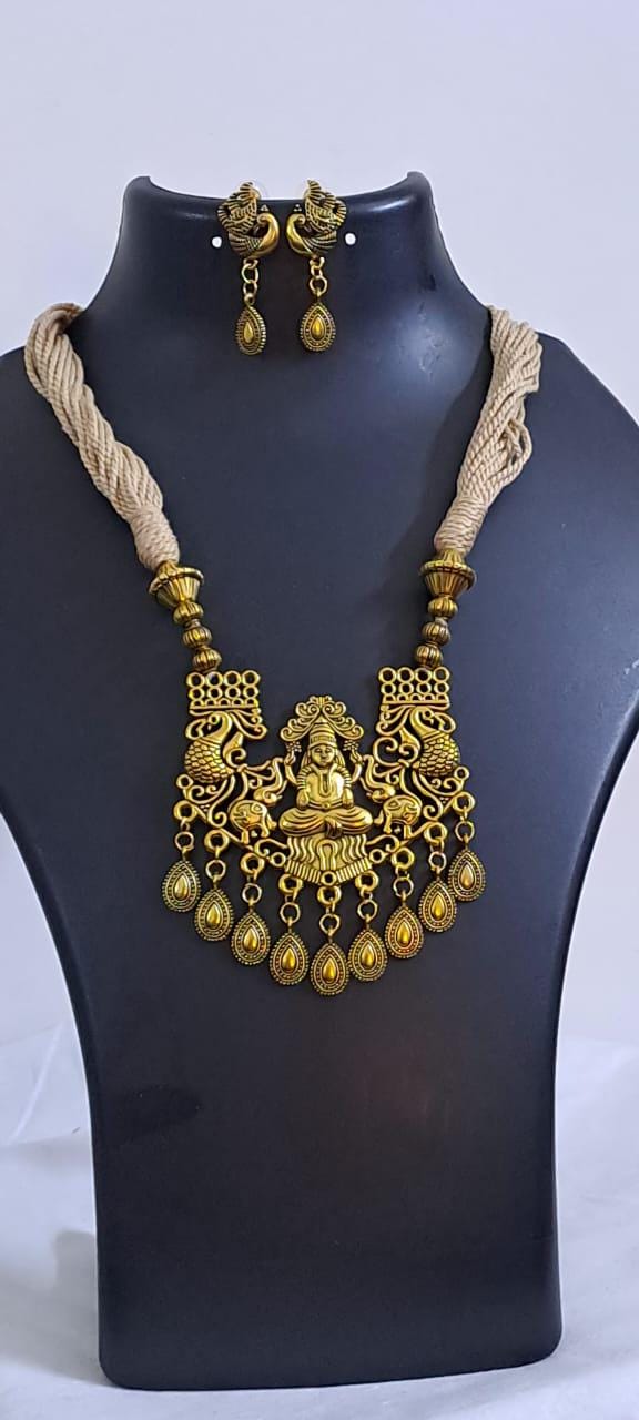 Off white thread necklace with Golden oxidised traditional pendant