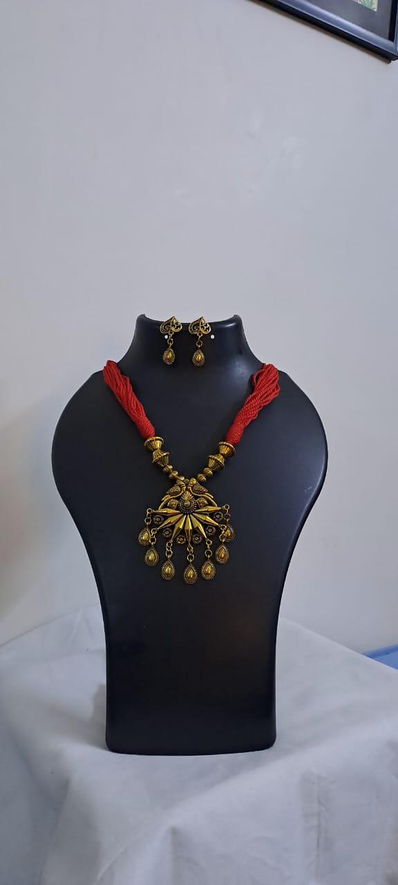 Red thread necklace with Golden oxidised traditional pendant