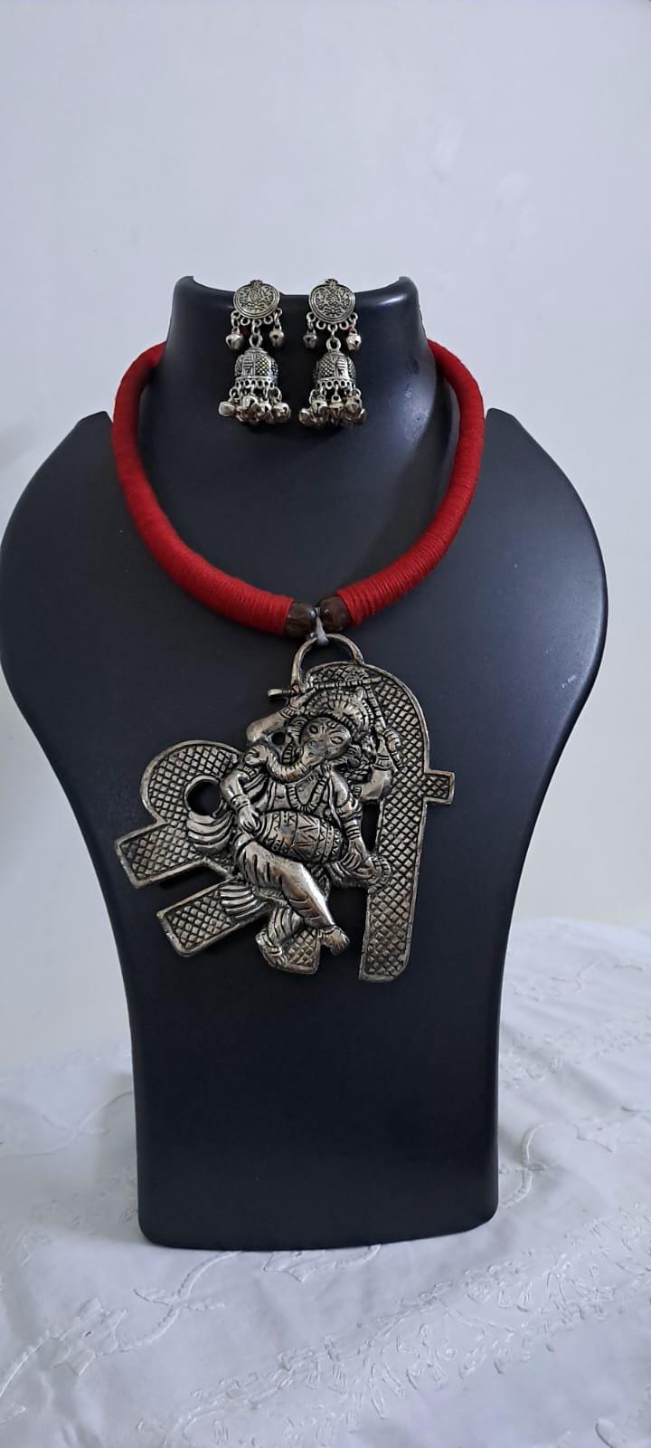 Red thread necklace with silver oxidised ganesha pendant