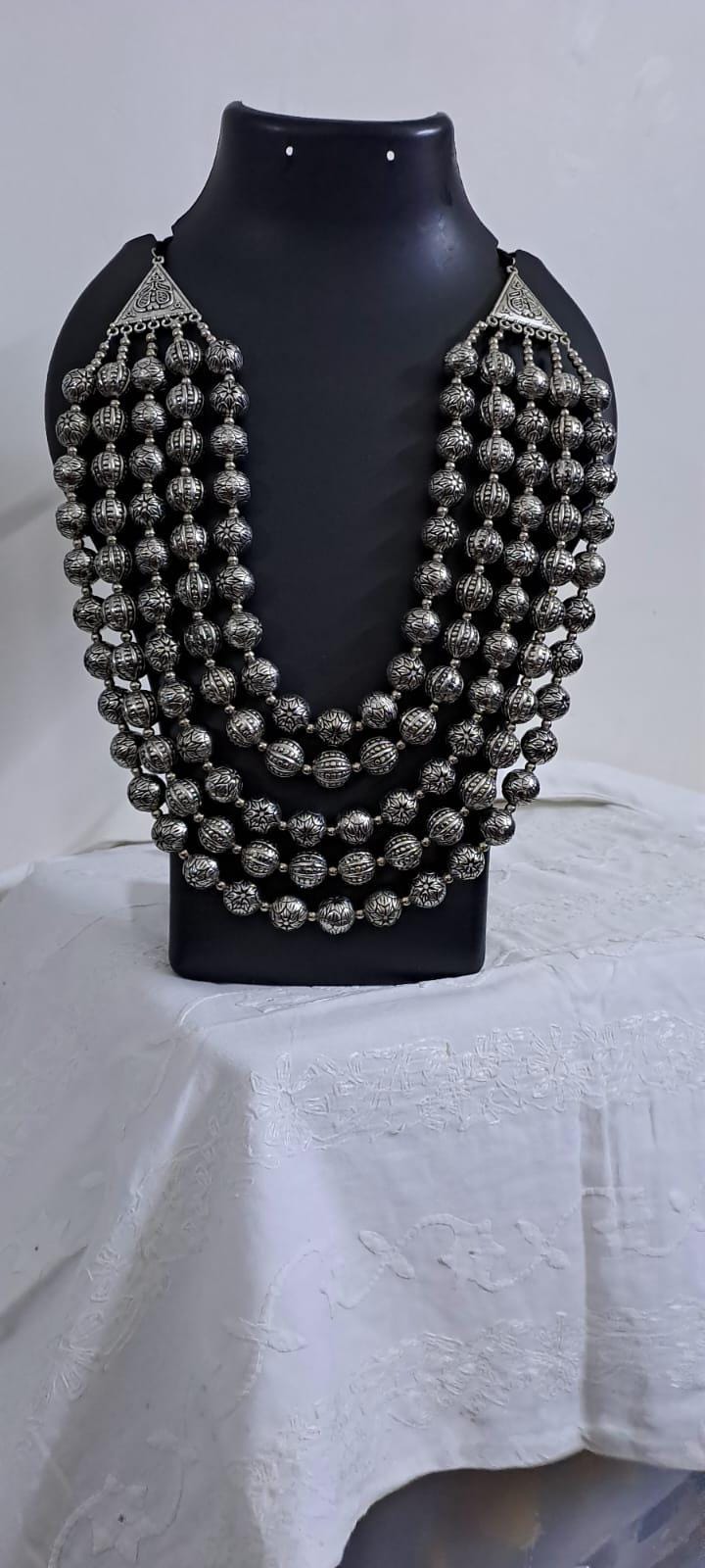 Multi-layered silver oxidised beads necklace .