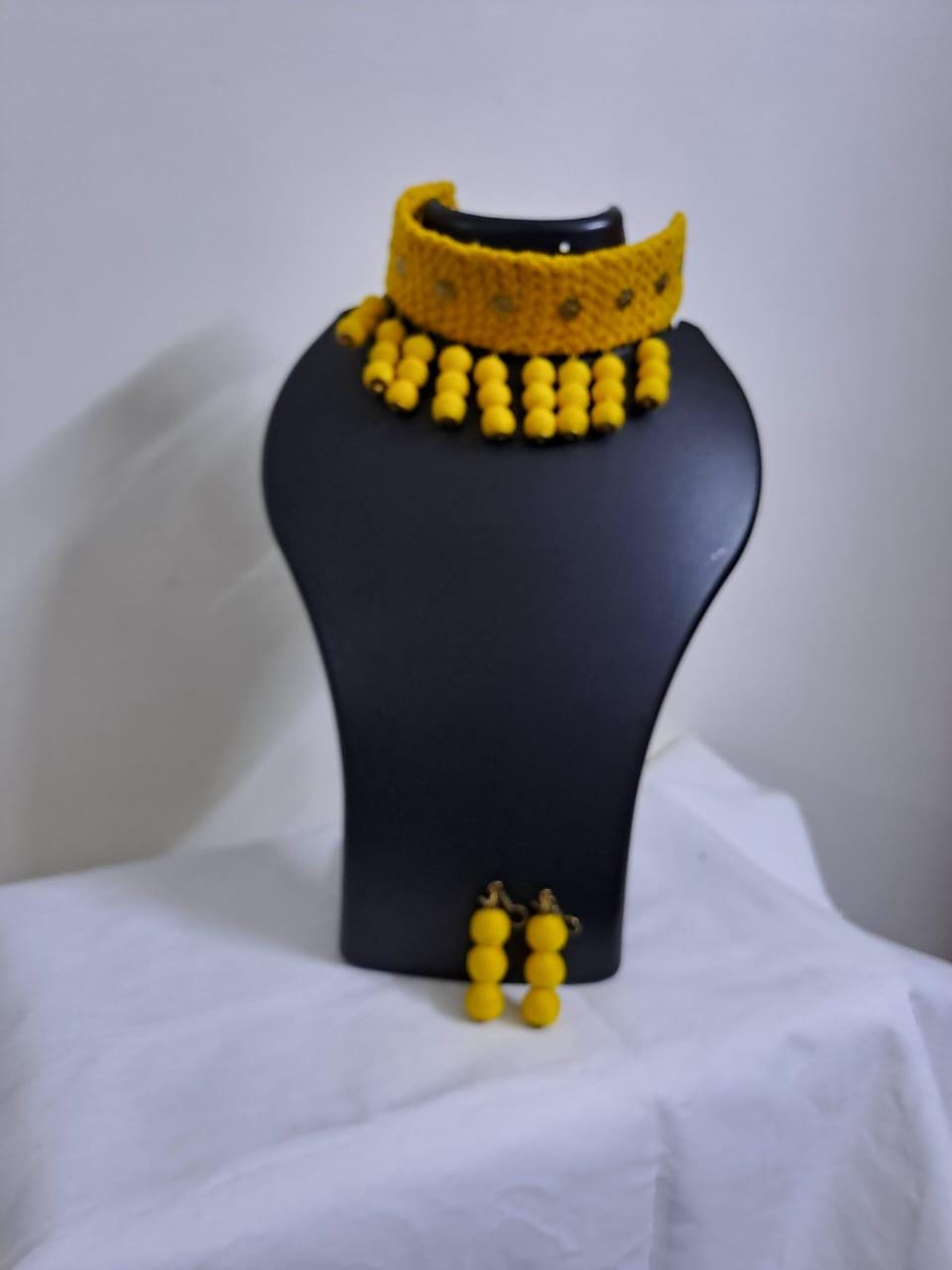 Yellow braided choker necklace set with fringes and matching earrings