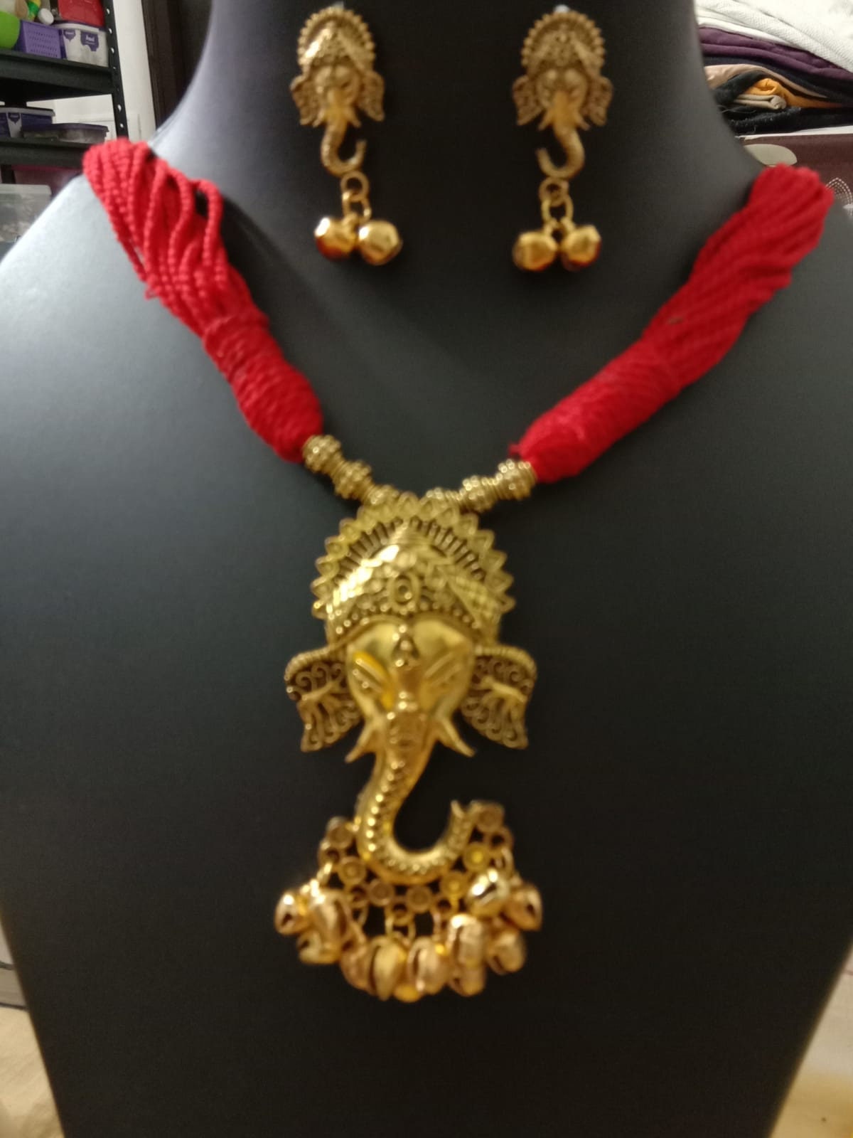 Oxidised golden ganesha traditional pendant and matching earrings.