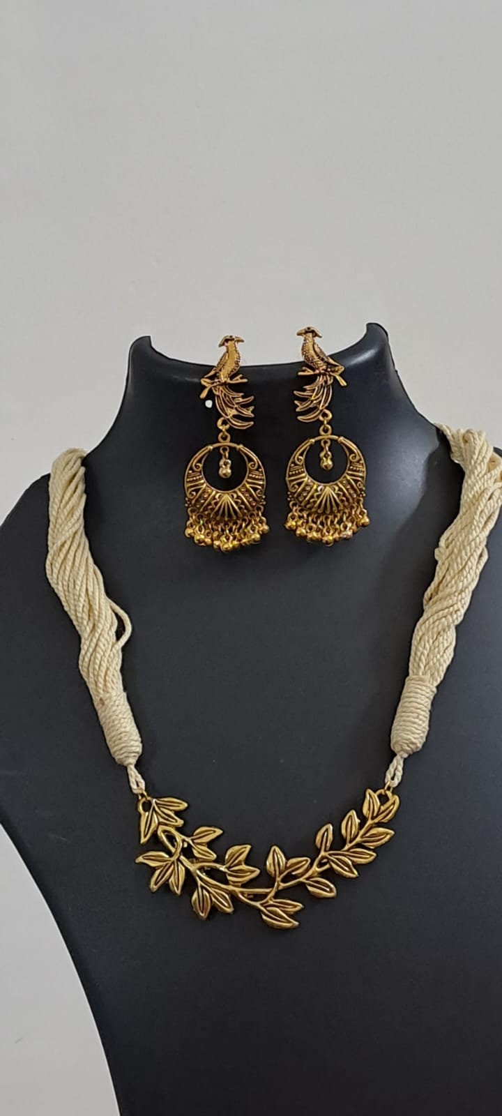 Off white thread necklace with Golden oxidised traditional pendant