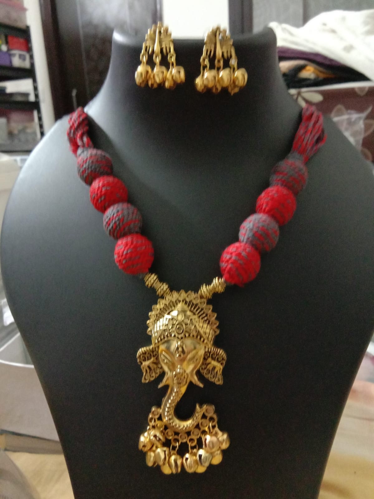 Oxidised golden ganesha traditional pendant and matching earrings.