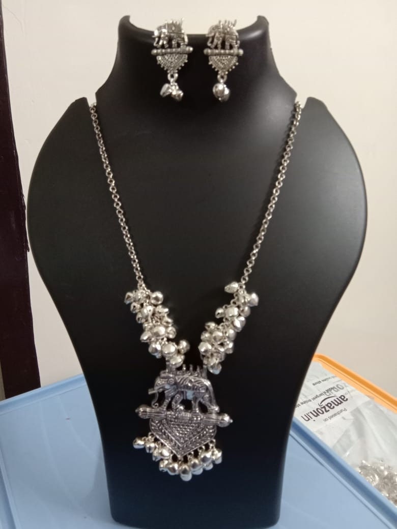 Oxidised silver chain with traditional pendant and matching earrings.