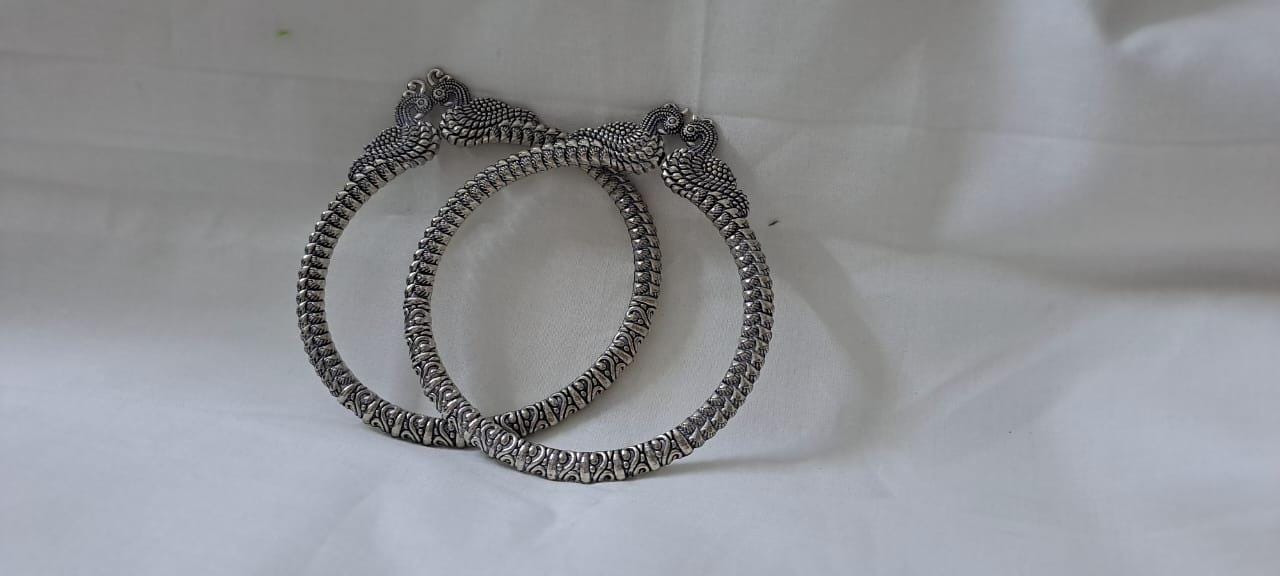 Traditional silver oxidised bangles with peacock