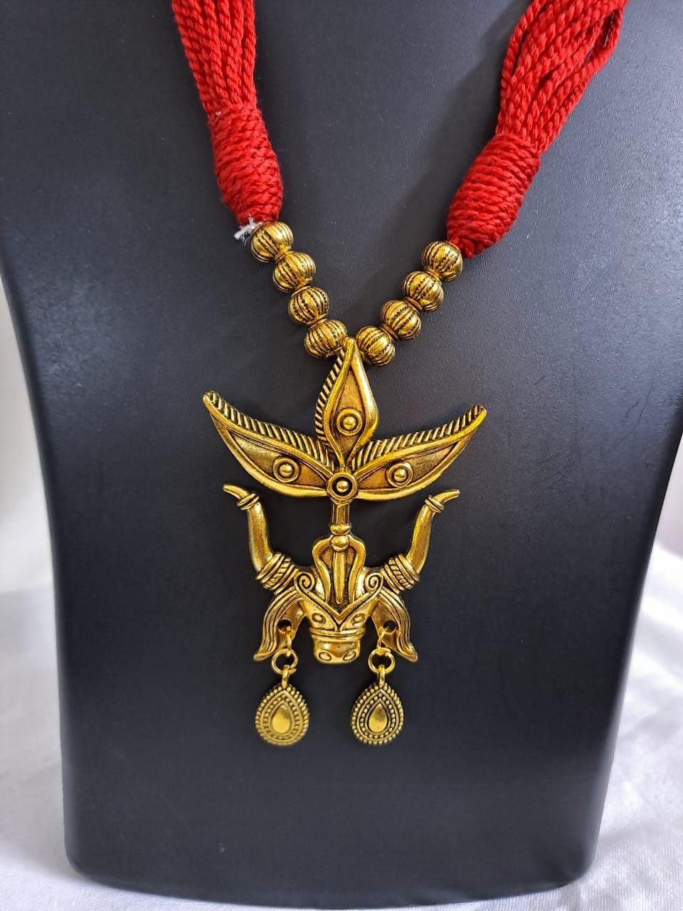 Red thread necklace with golden oxidised Durga pendant n matching earrings