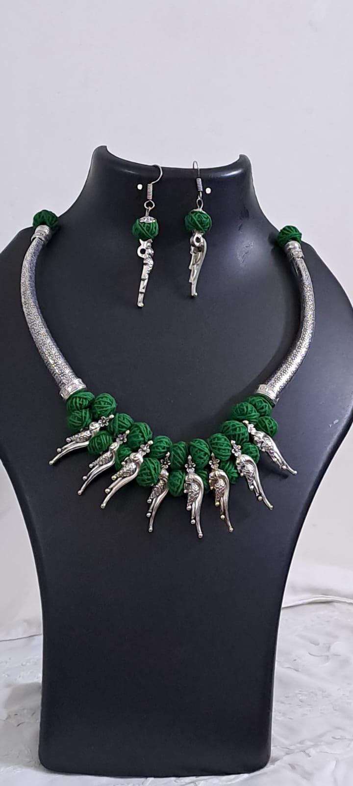Green thread necklace with kolhapuri silver oxidised traditional beads and matching earrings