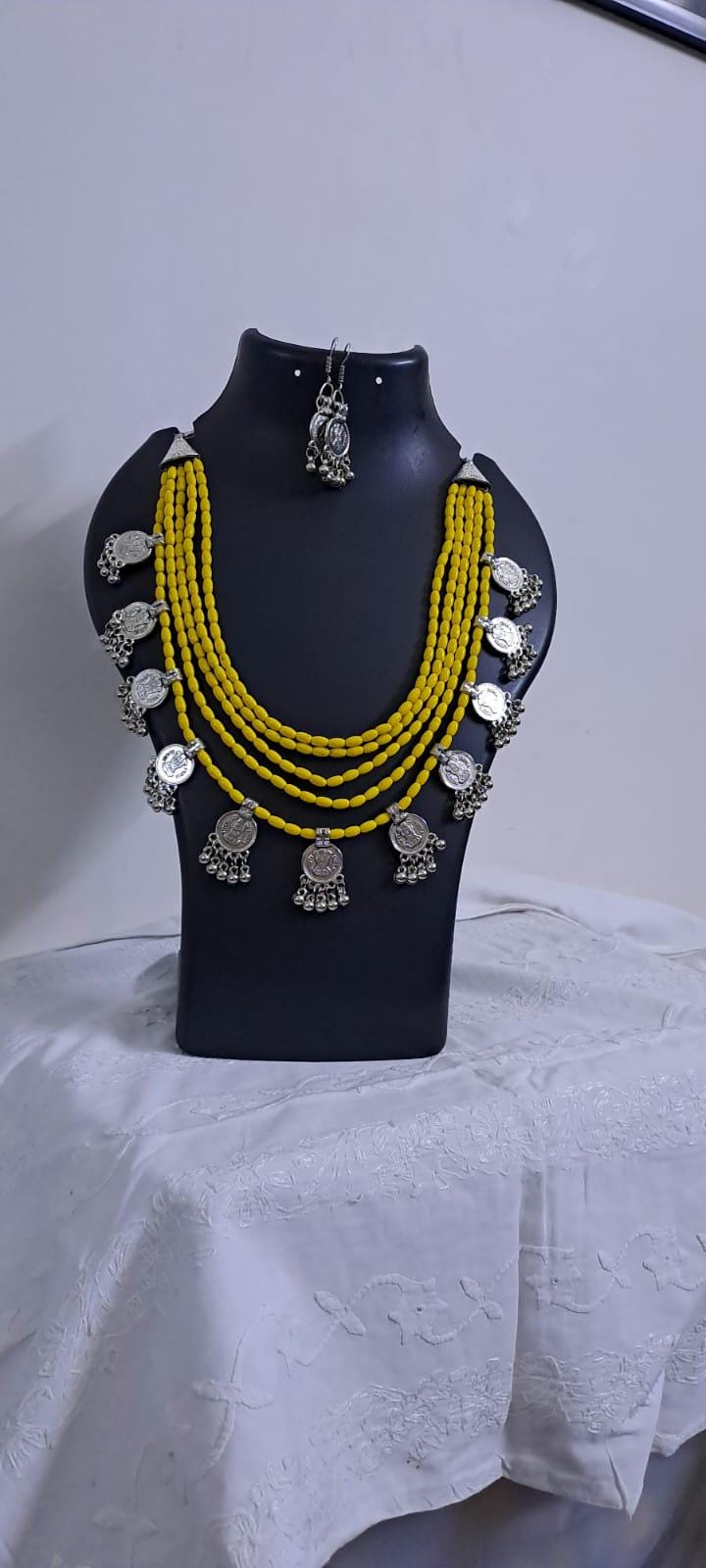 Exclusive multi layered  yellow glass beads necklace set with silver oxidised charms n matching earrings