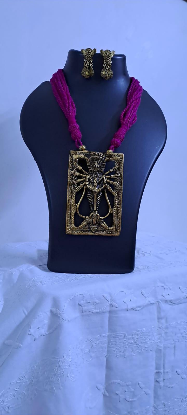 Pink thread necklace with oxidised golden durga pendant