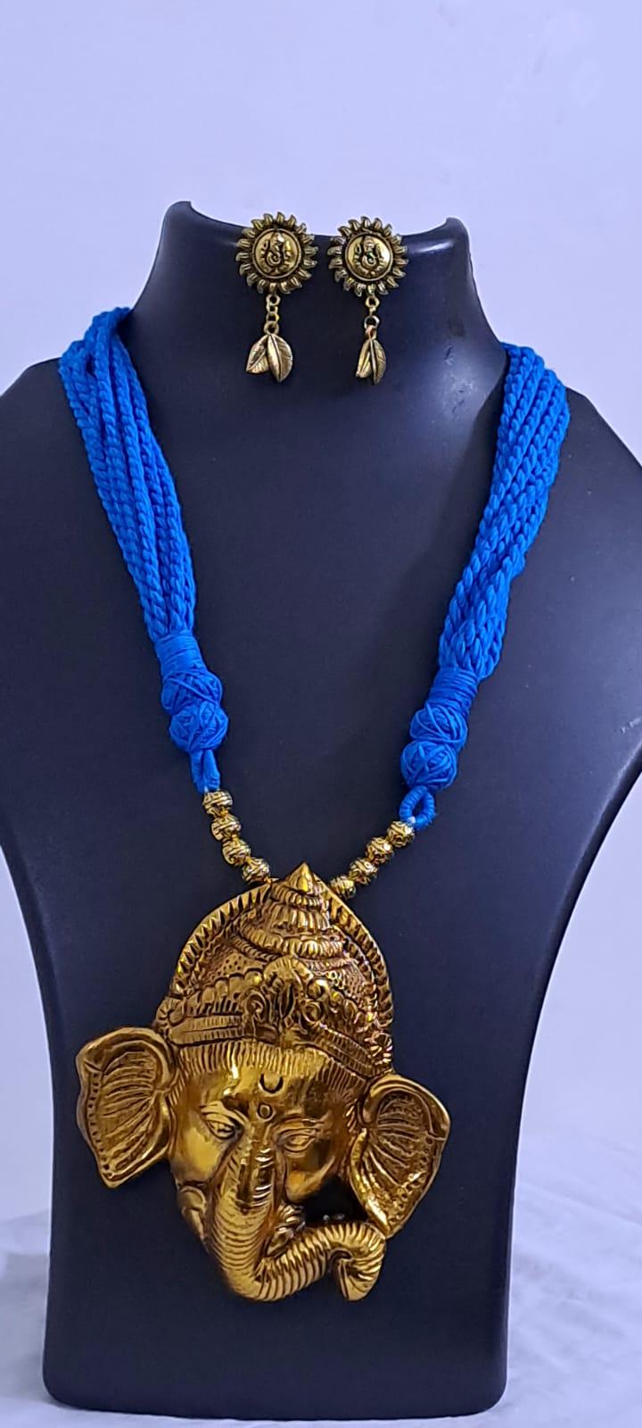 Blue thread necklace with golden oxidised ganesha pendant