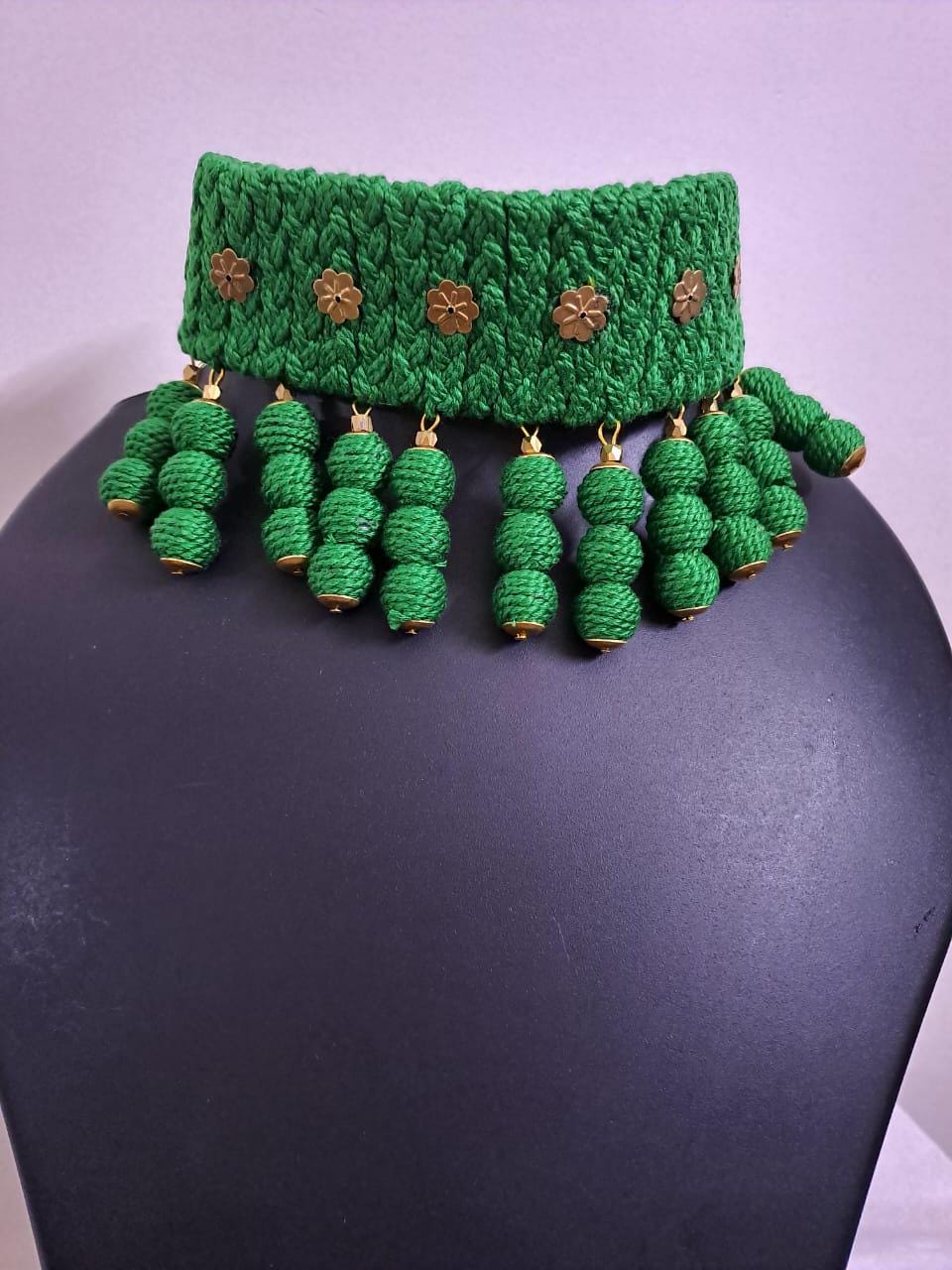 Green braided choker necklace set with fringes and matching earrings
