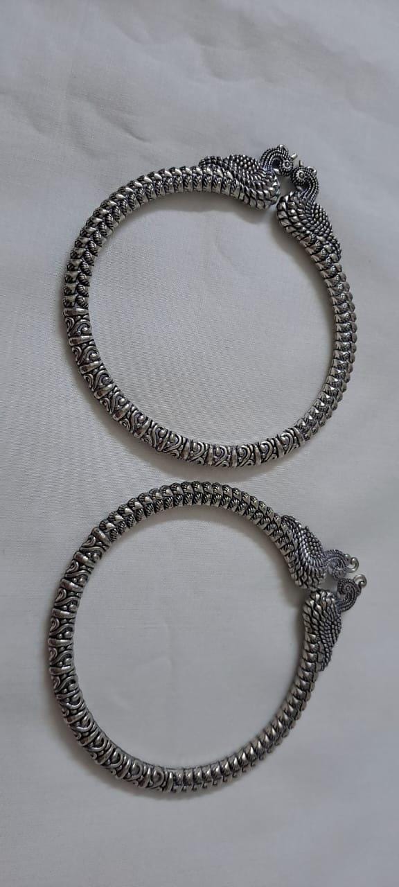 Traditional silver oxidised bangles with peacock