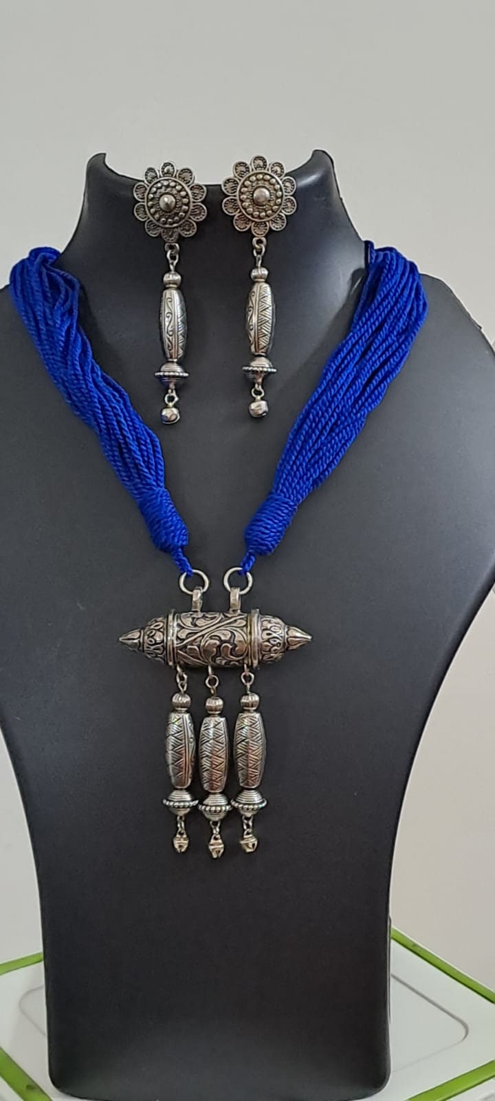 Blue thread necklace with silver oxidised traditional pendant