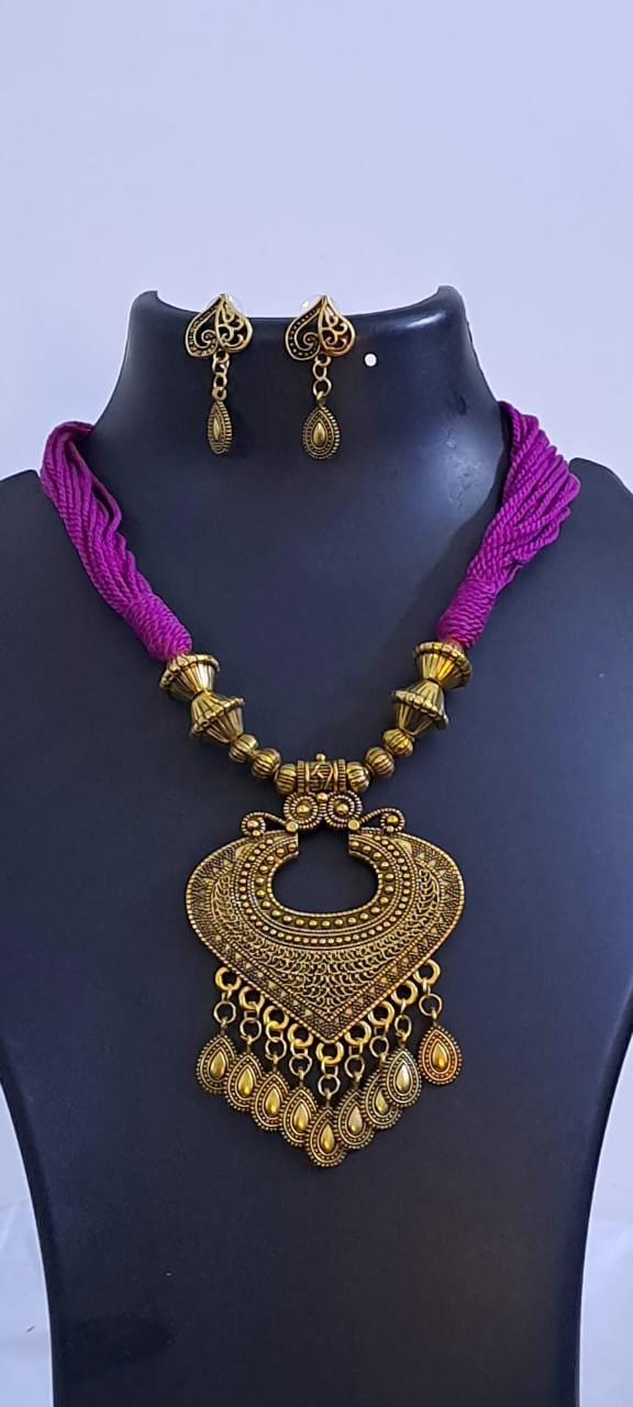 Purple thread necklace with Golden oxidised traditional pendant