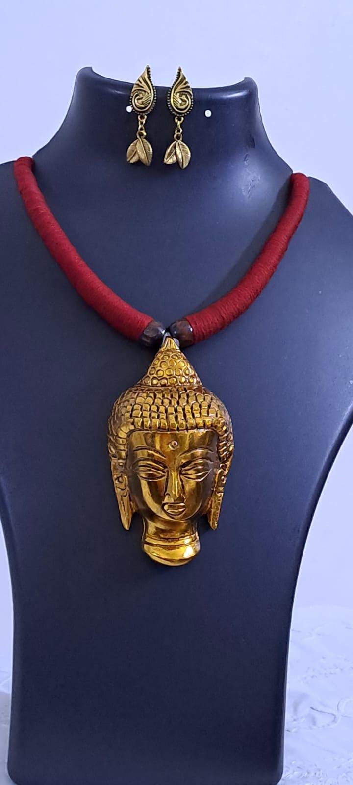 Maroon thread necklace with oxidised golden buddha pendant
