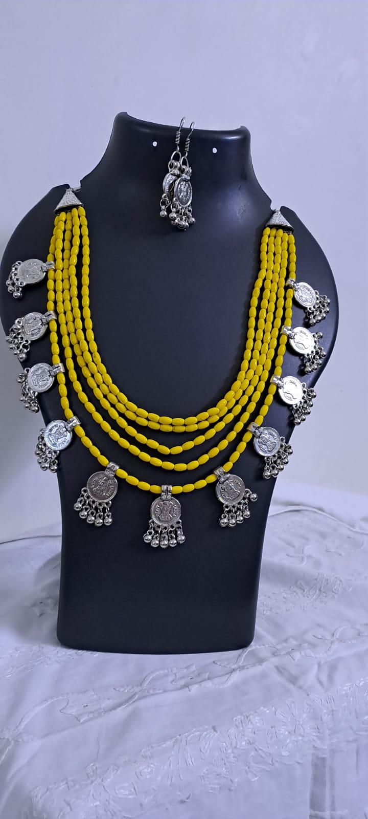 Exclusive multi layered  yellow glass beads necklace set with silver oxidised charms n matching earrings