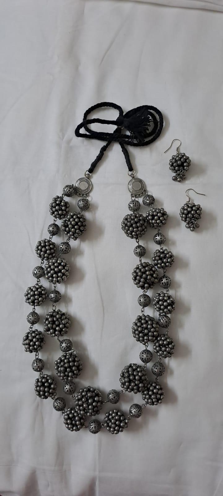 Exclusive silver oxidised long chain set with matching earrings